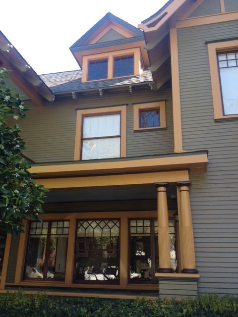 A house with a lot of windows and a porch