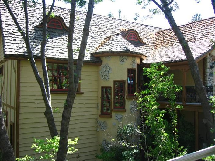 A house with a stained glass window on the side