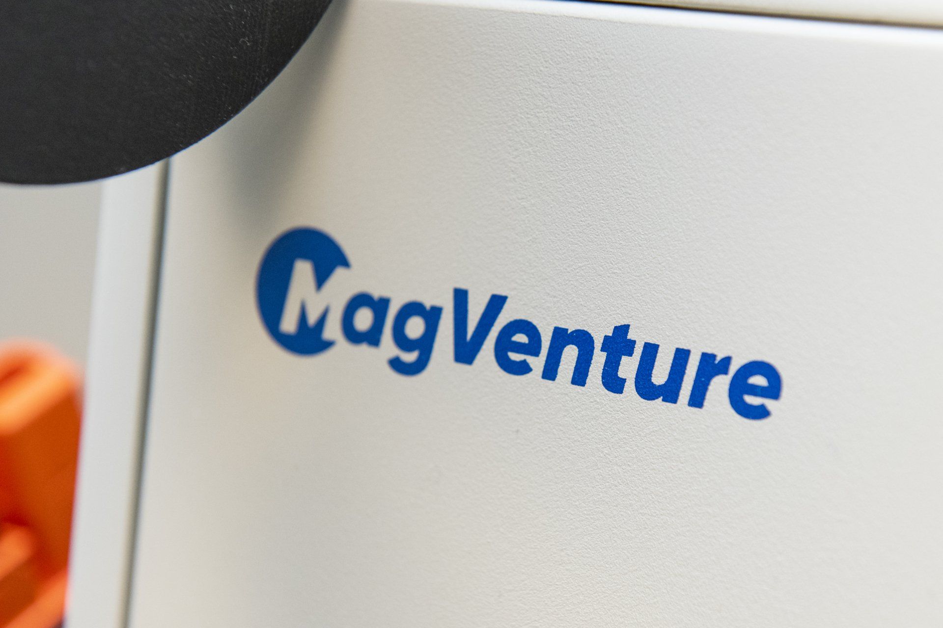 a close up of a magventure logo on a white box