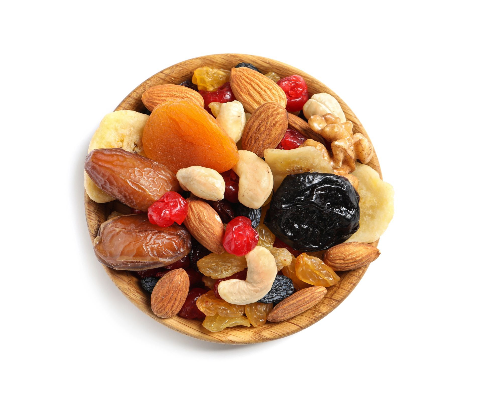Tazón de frutos secos y frutas deshidratadas mixtas: almendras, anacardos, dátiles, albaricoques, pasas y cerezas.