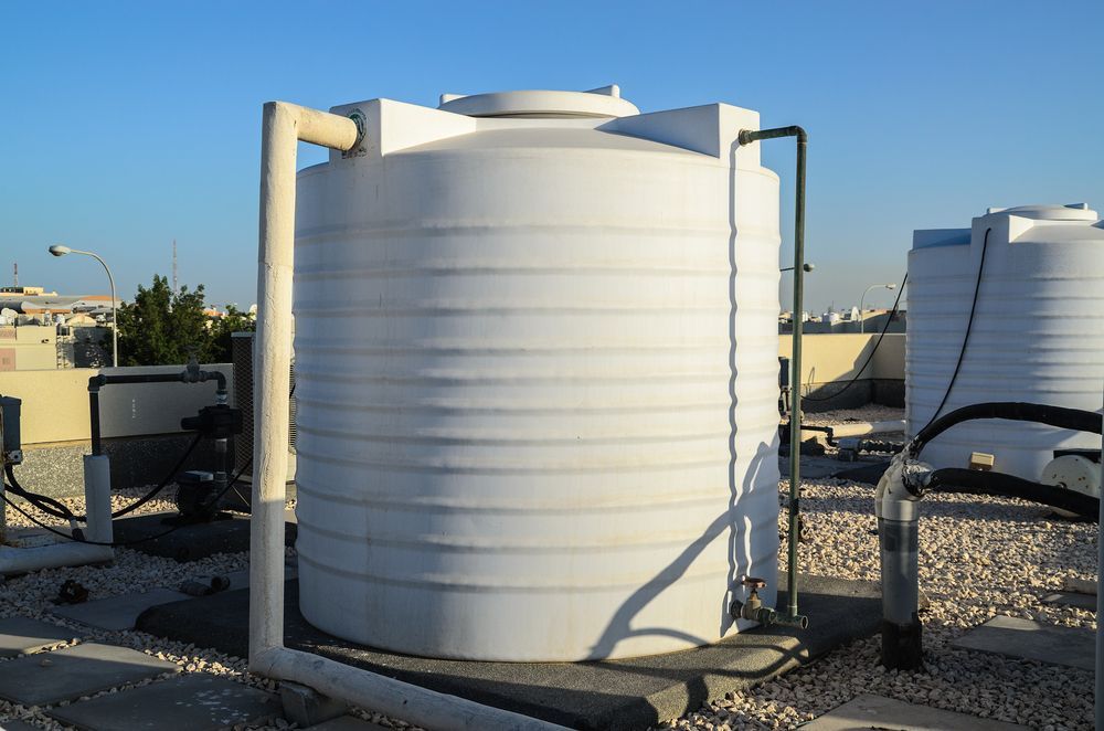 White Water Tank on a Rooftop — Raptor Waste Management In Coomera, QLD