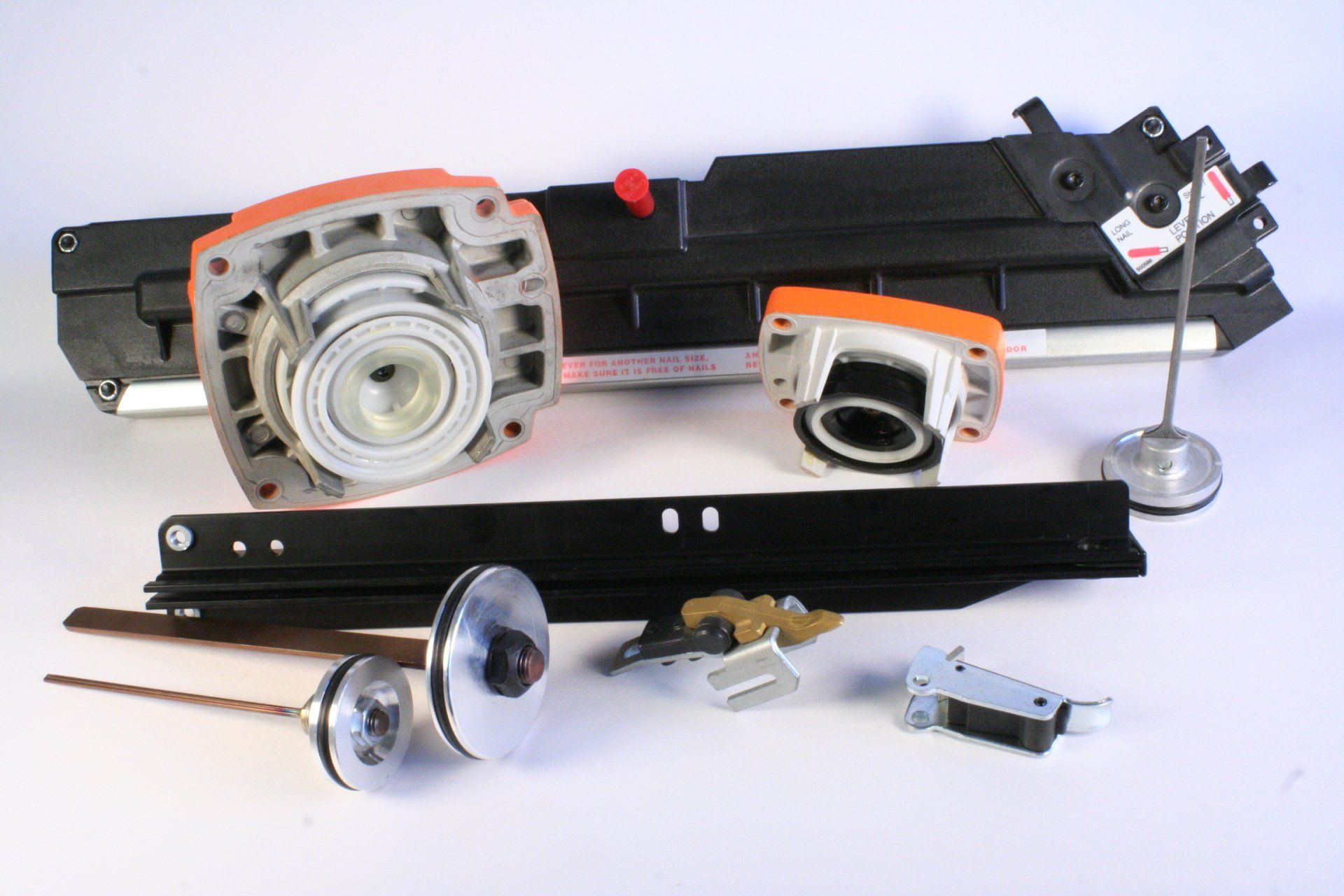 A bunch of tools are laying on a white surface