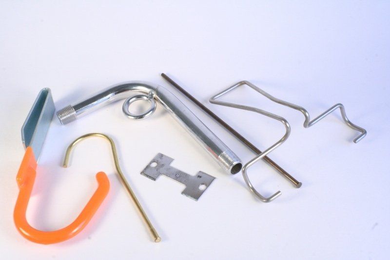 A bunch of metal objects on a white surface