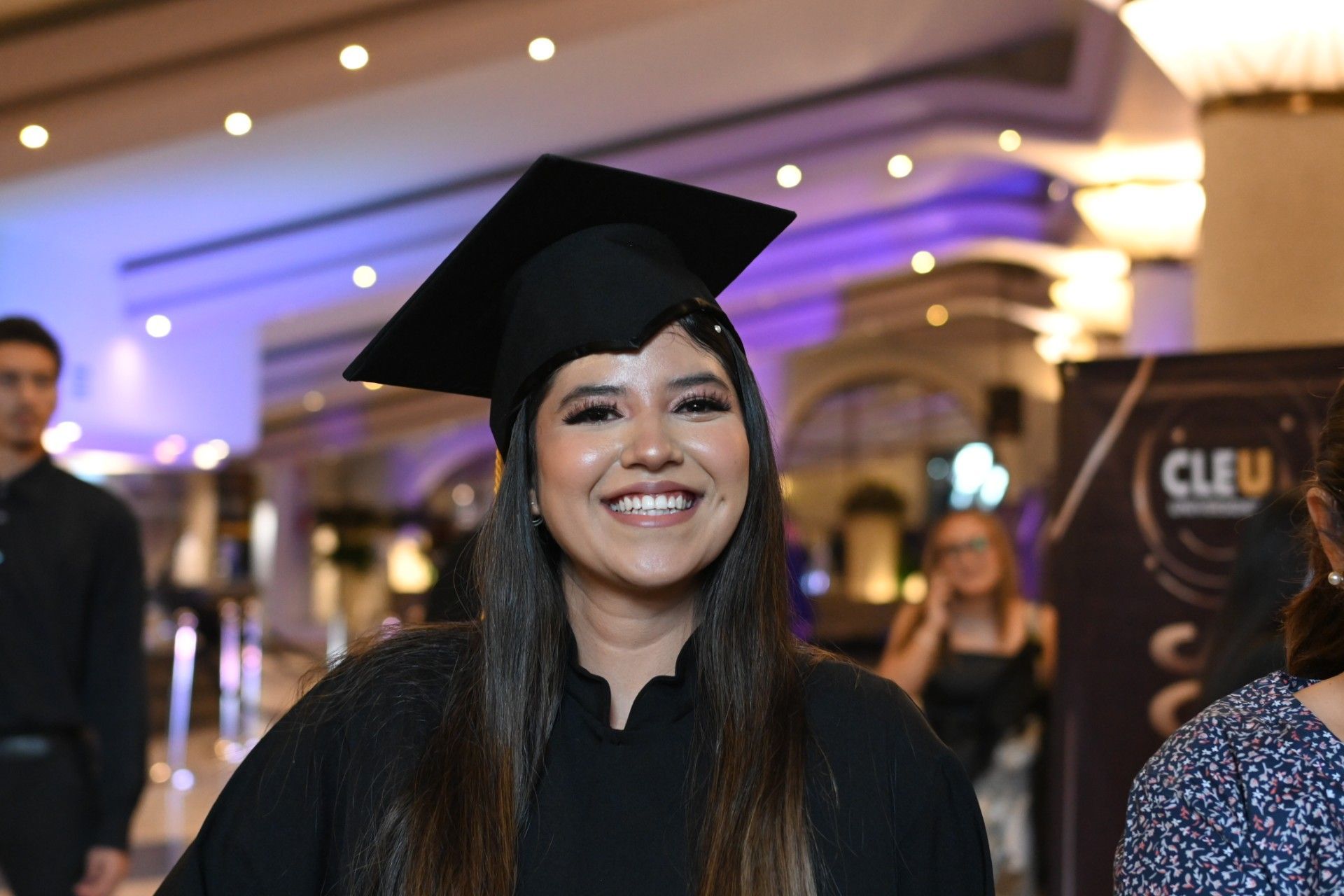A red and blue cube is sitting on a blue surface.
