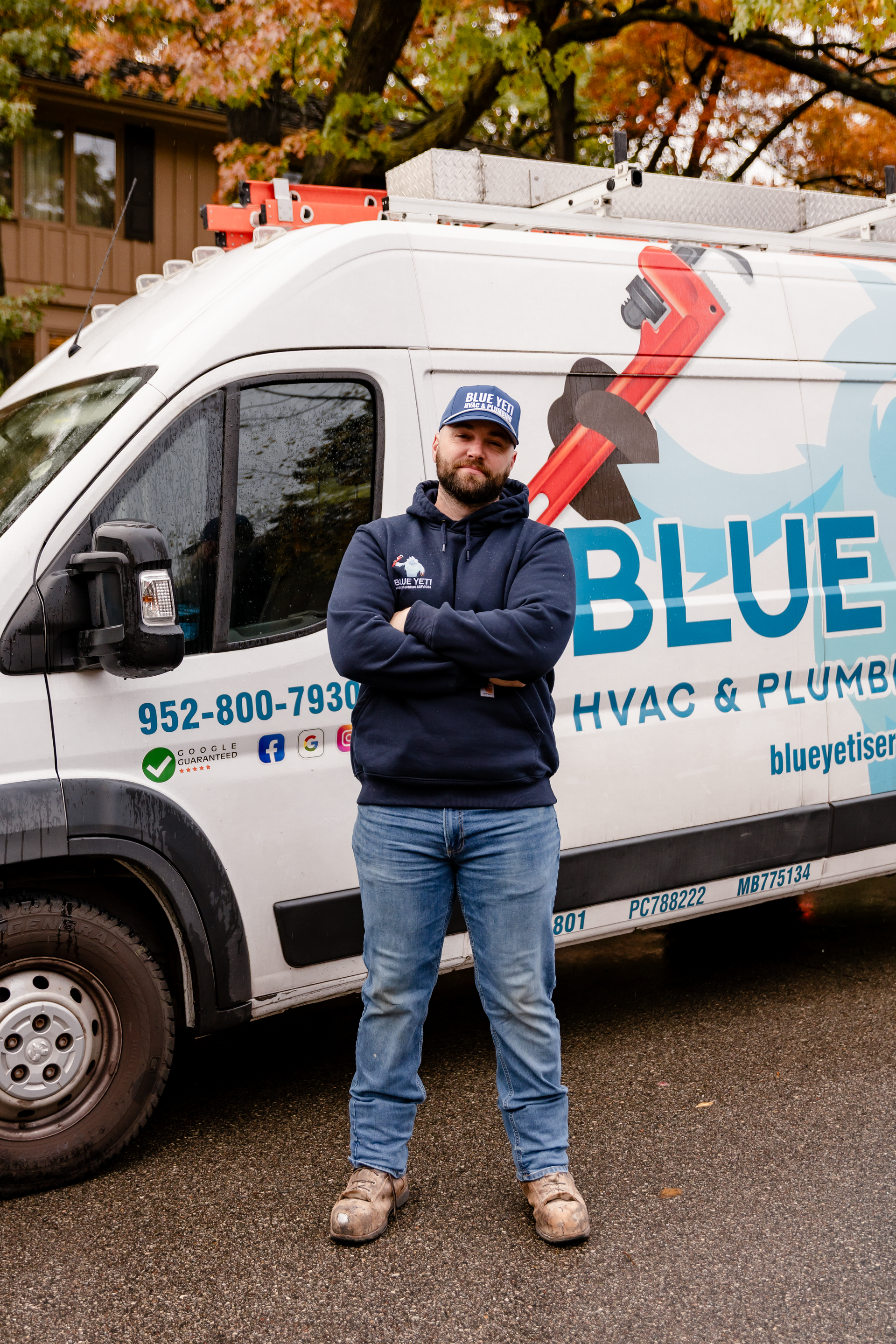 Blue Yeti Service technician standing next to service van