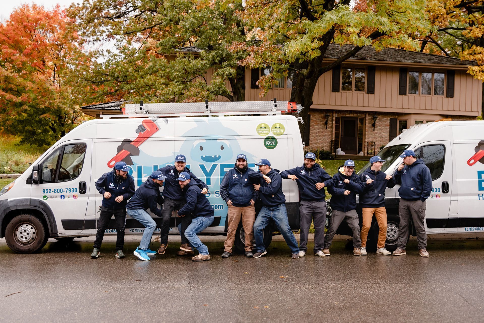 Blue Yeti HVAC Plumbing HVAC technician work crew posing with their service van