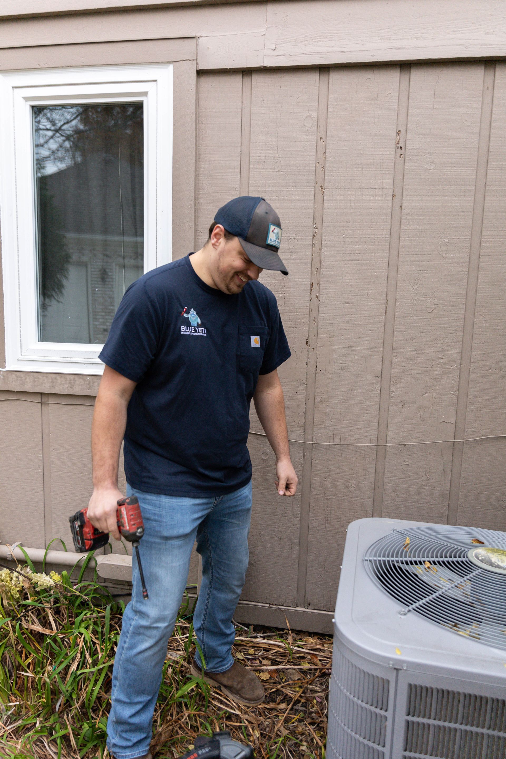Blue Yeti Service technician working on ac unit outside