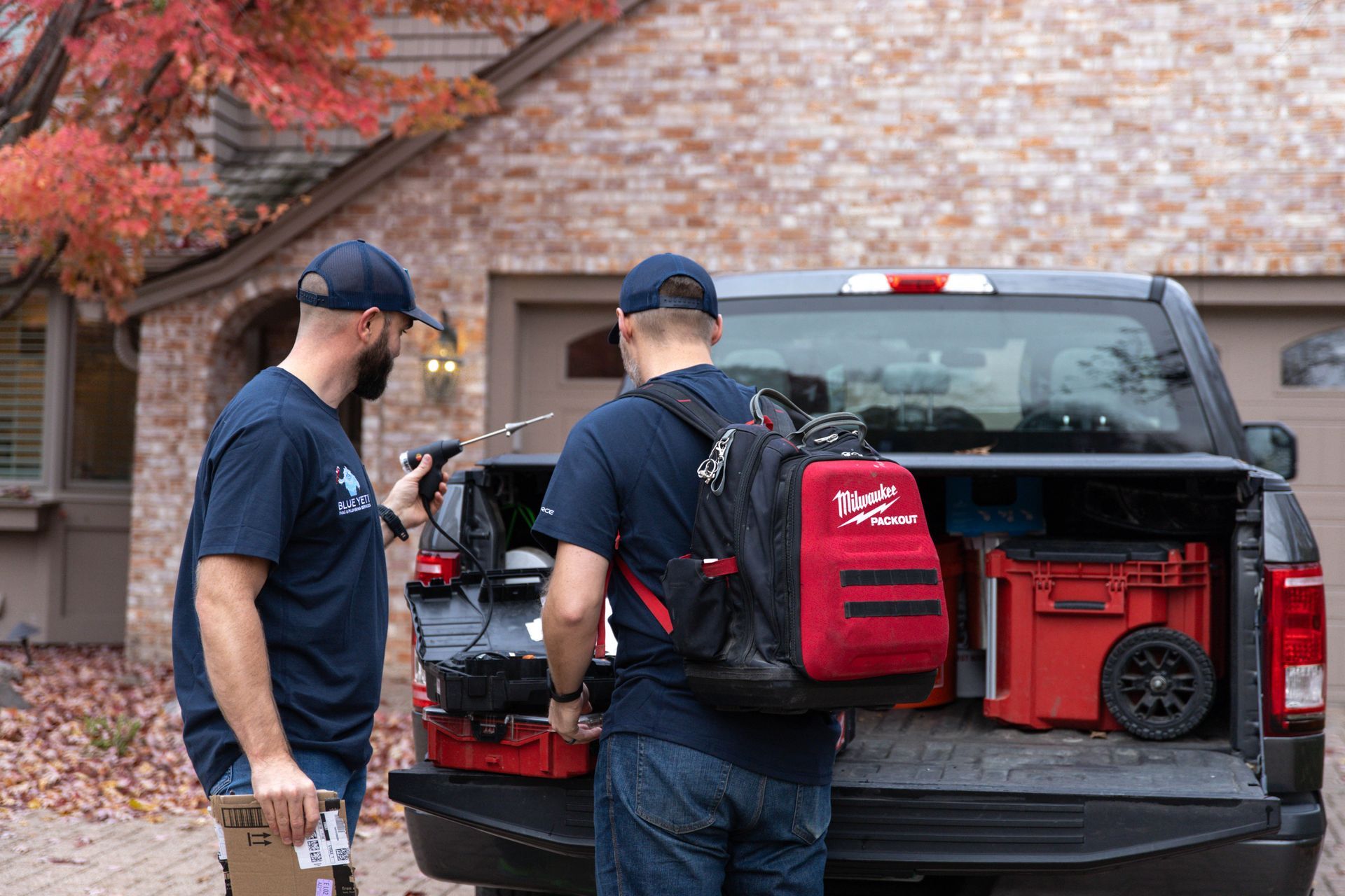 Blue Yeti Service technician working on HVAC unit outside