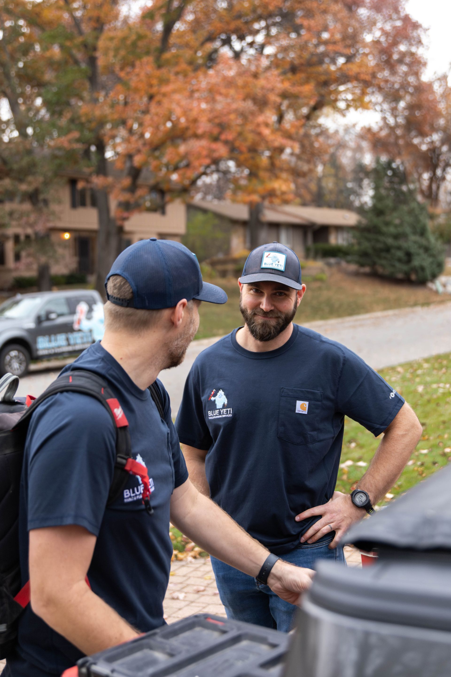 Blue Yeti Service technician next to work van