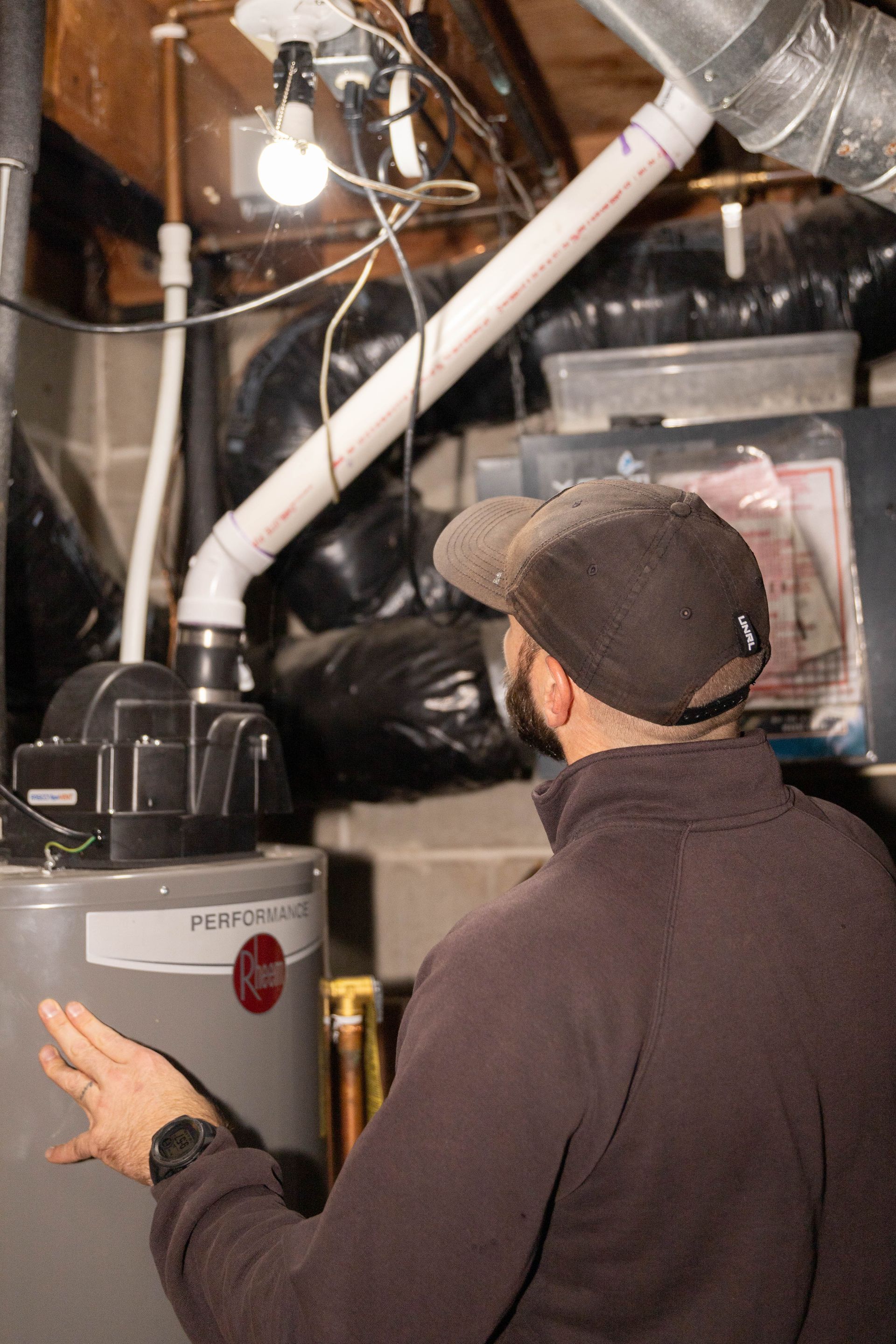 water heater being repaired by blue yeti services