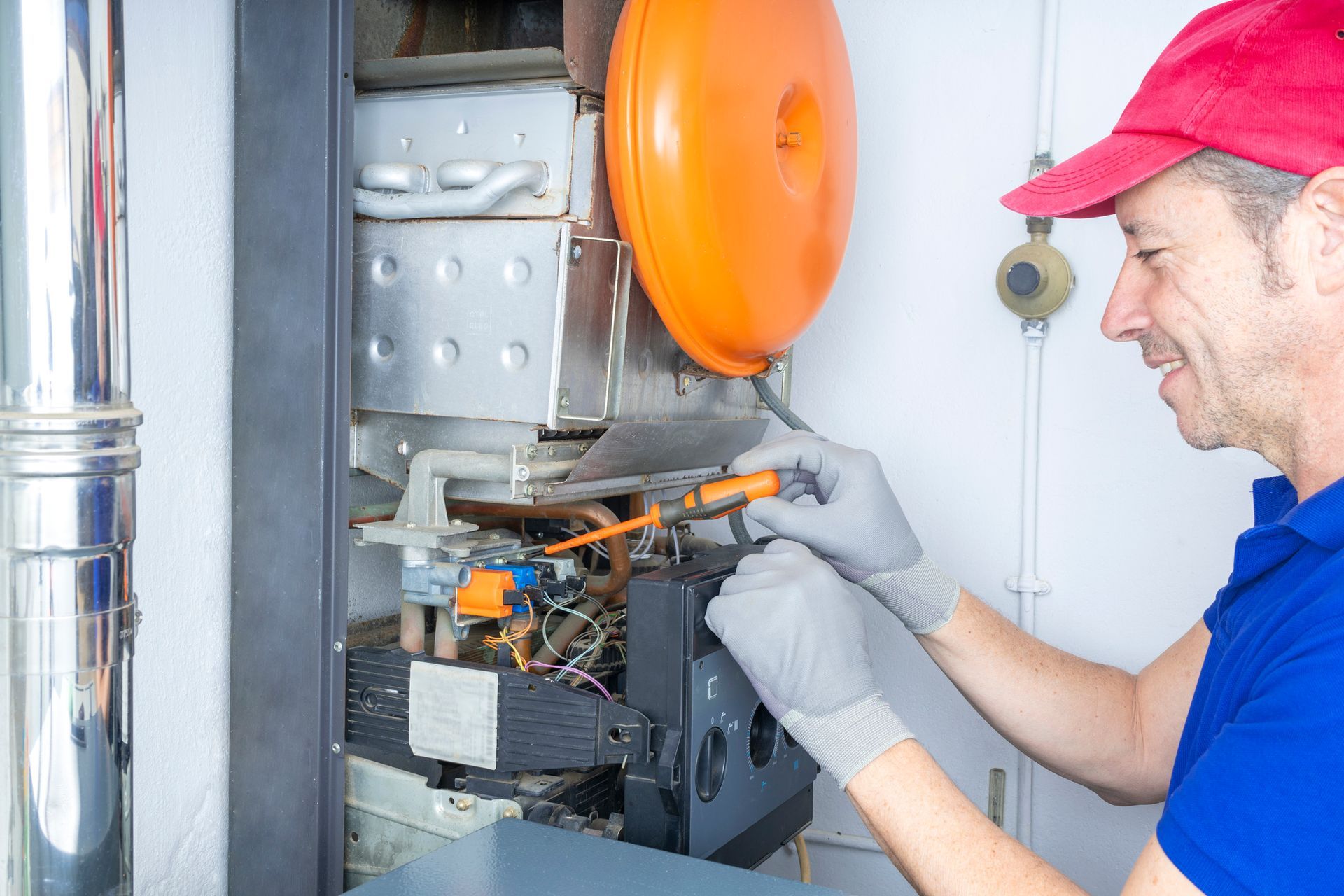 Blue Yeti technician working on furnace maintenance.