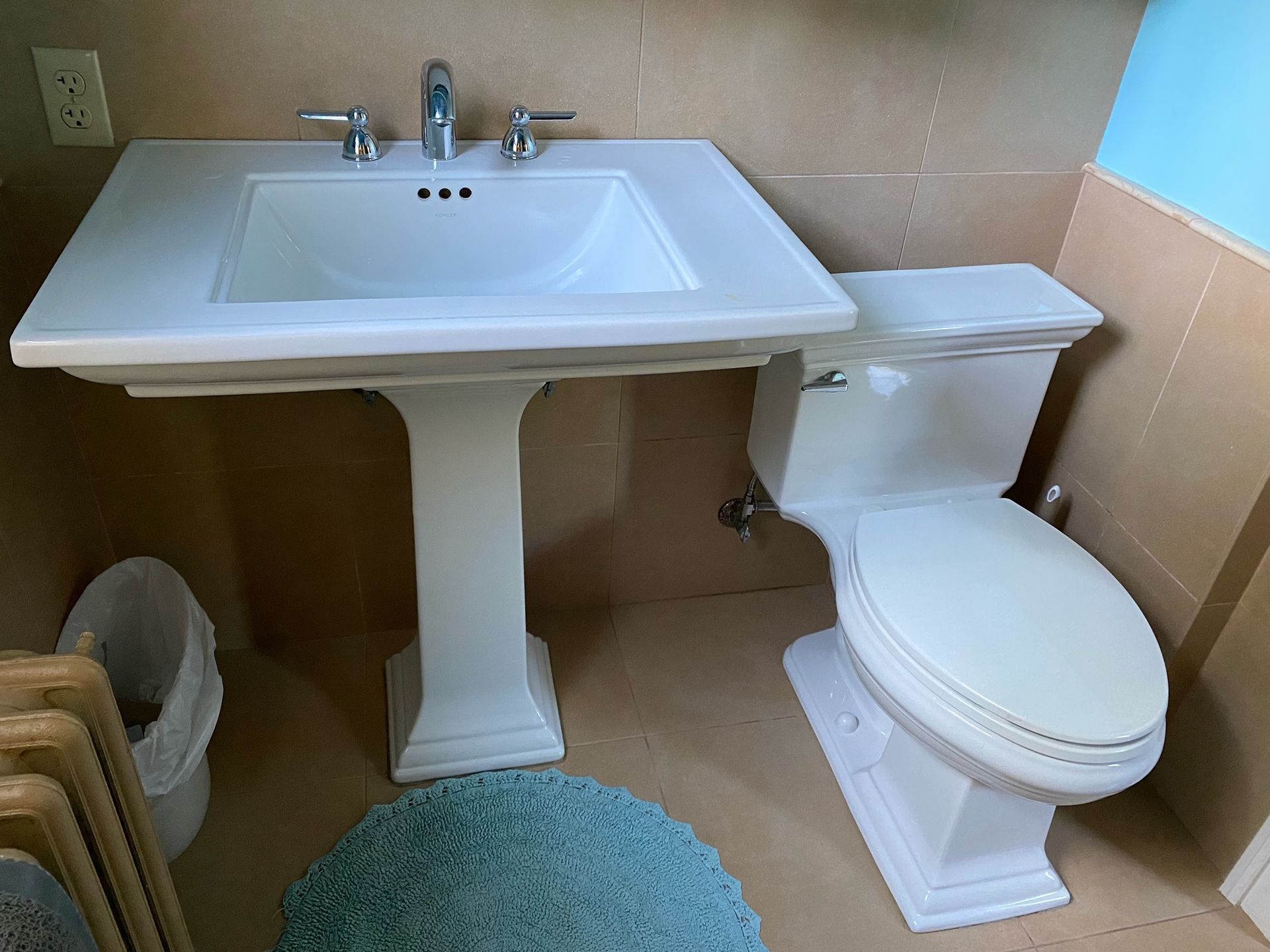 bathroom sink and toilet showing blue yeti services plumbing