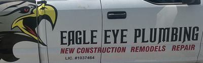 An eagle eye plumbing truck has a picture of an eagle on the side