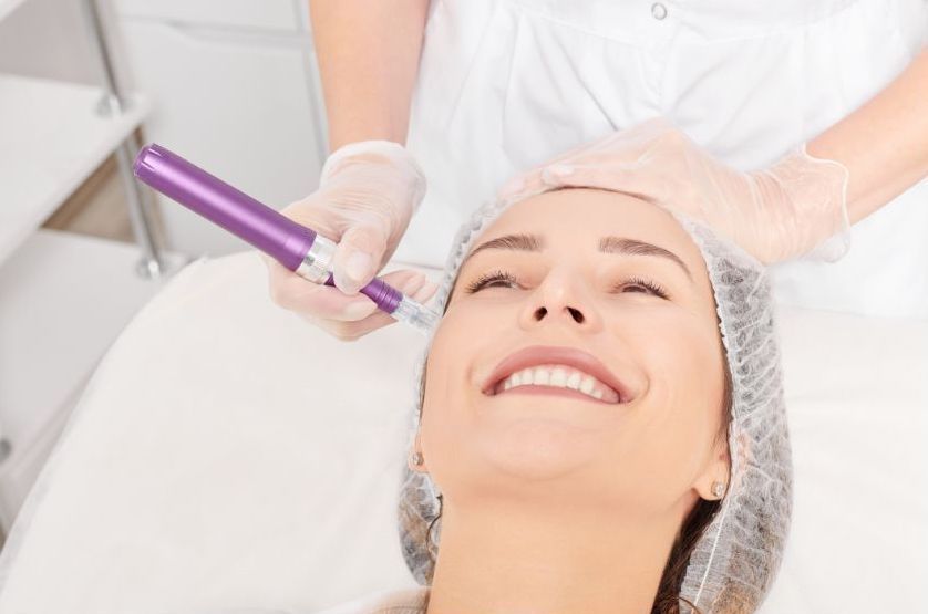 A woman is getting a facial treatment at a beauty salon.