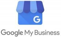 Google My Business logo: blue building icon with a striped awning and a white 