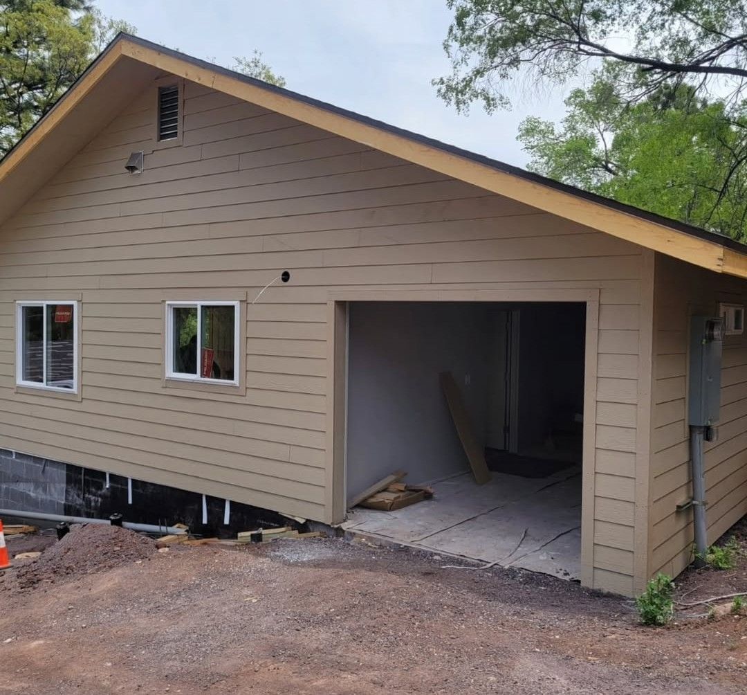 A house with a garage underneath it is being built