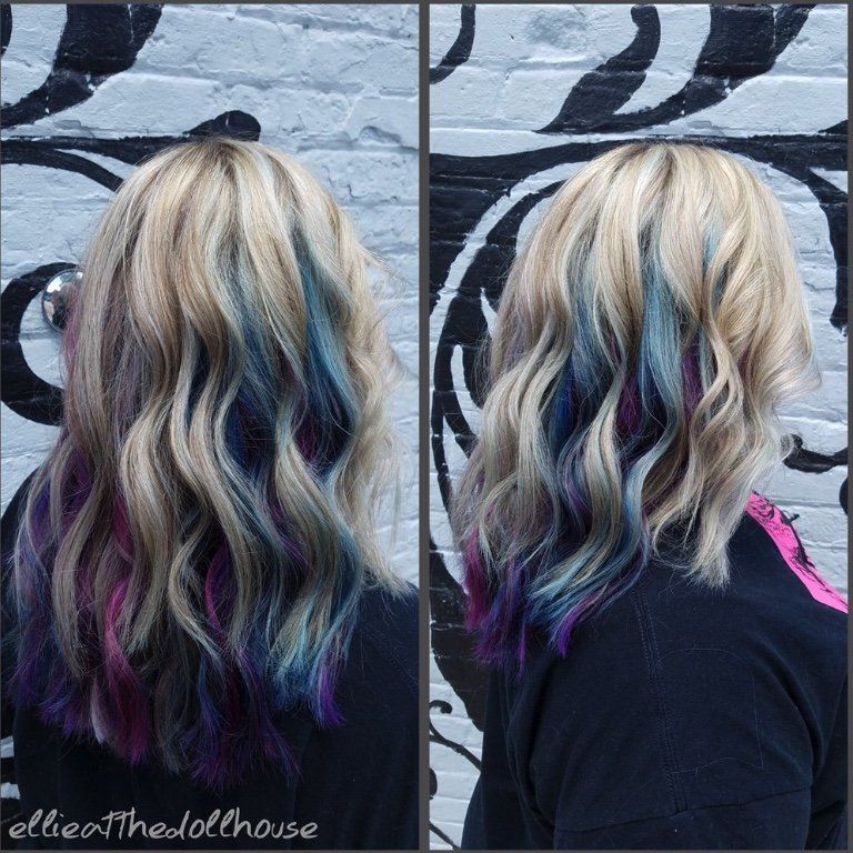 A woman with blonde hair and blue and purple highlights