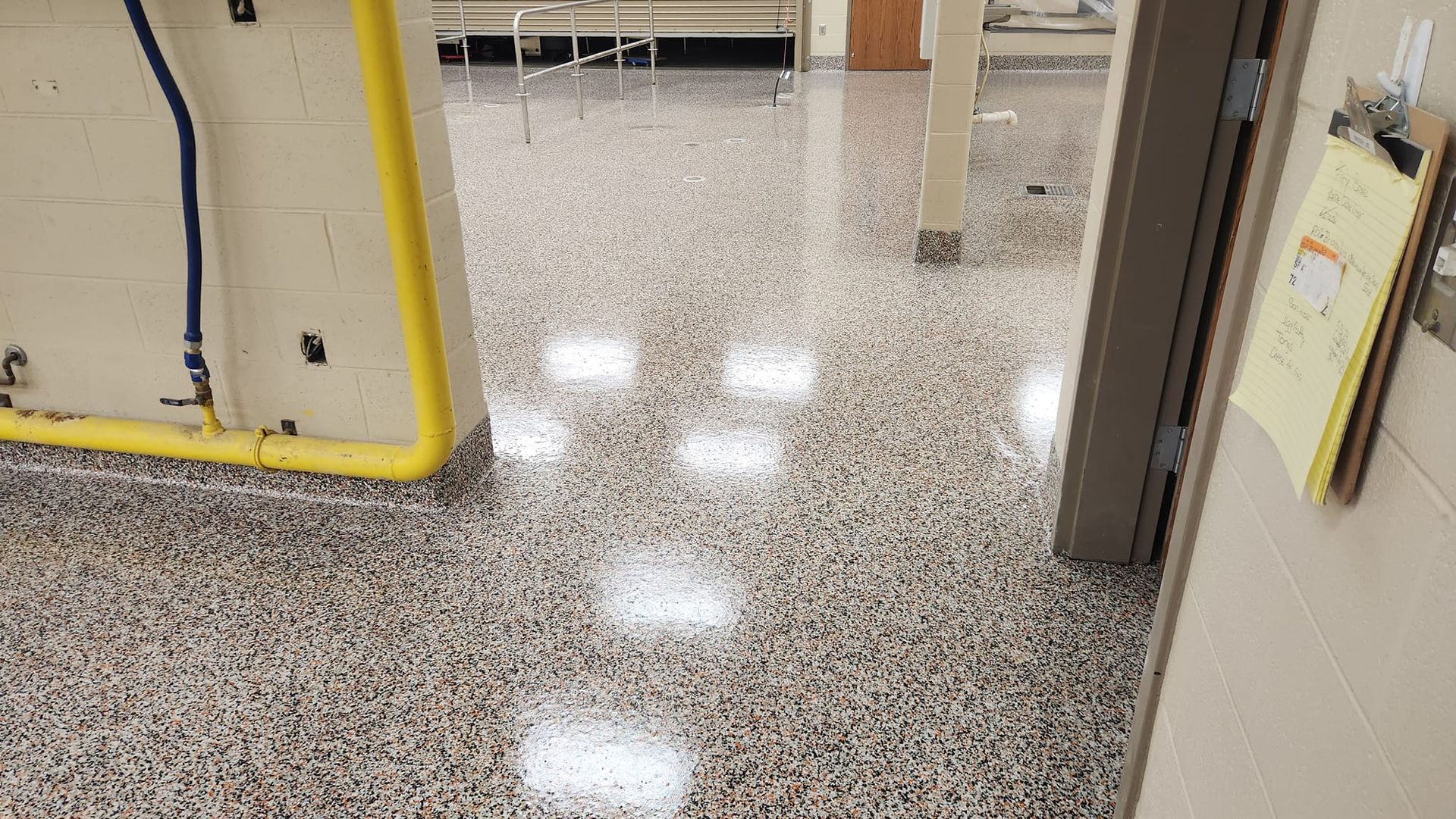 A room with a shiny antimicrobial floor.