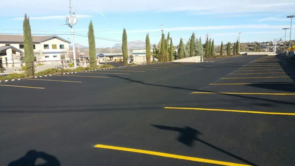 Empty Parking Lot with Yellow Guide Lines — Prescott, AZ — Maurer Sealing & Striping