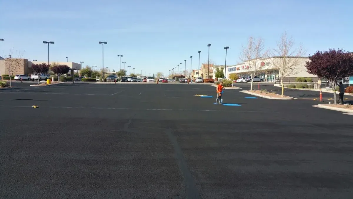 An Empty Parking Lot in Front of a Shopping Center — Prescott, AZ — Maurer Sealing & Striping