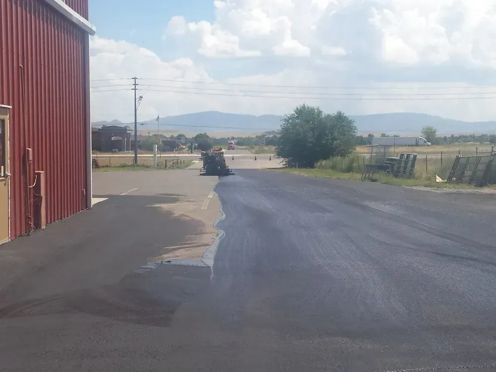 A Road with Asphalt in Front of a Warehouse — Prescott, AZ — Maurer Sealing & Striping