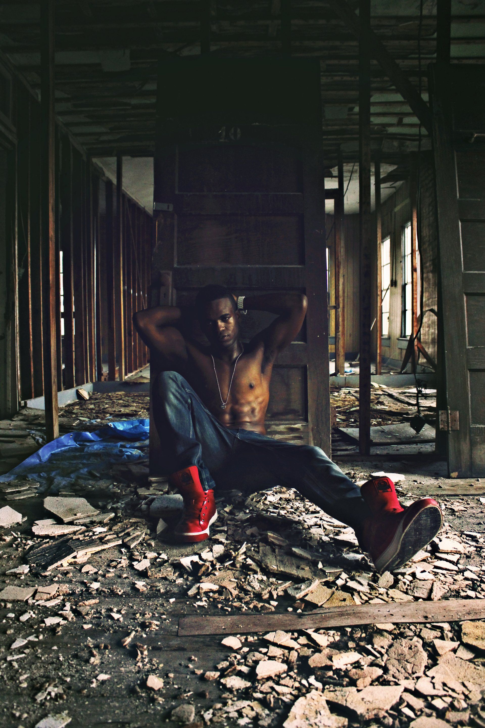MLN sitting on the ground in an abandoned building