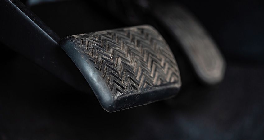 a close up of a brake pedal in a car .