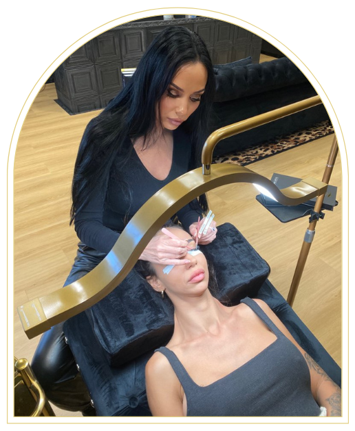 A Woman Laying Down Getting Her Eyelashes Done By A Lash Technician — Black Lash Cartel In Mermaid Waters, QLD