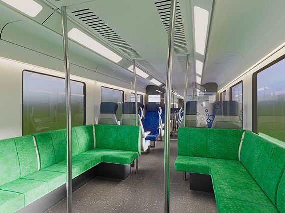 Afbeelding van een loungehoek met grasgroene loungebanken in de trein