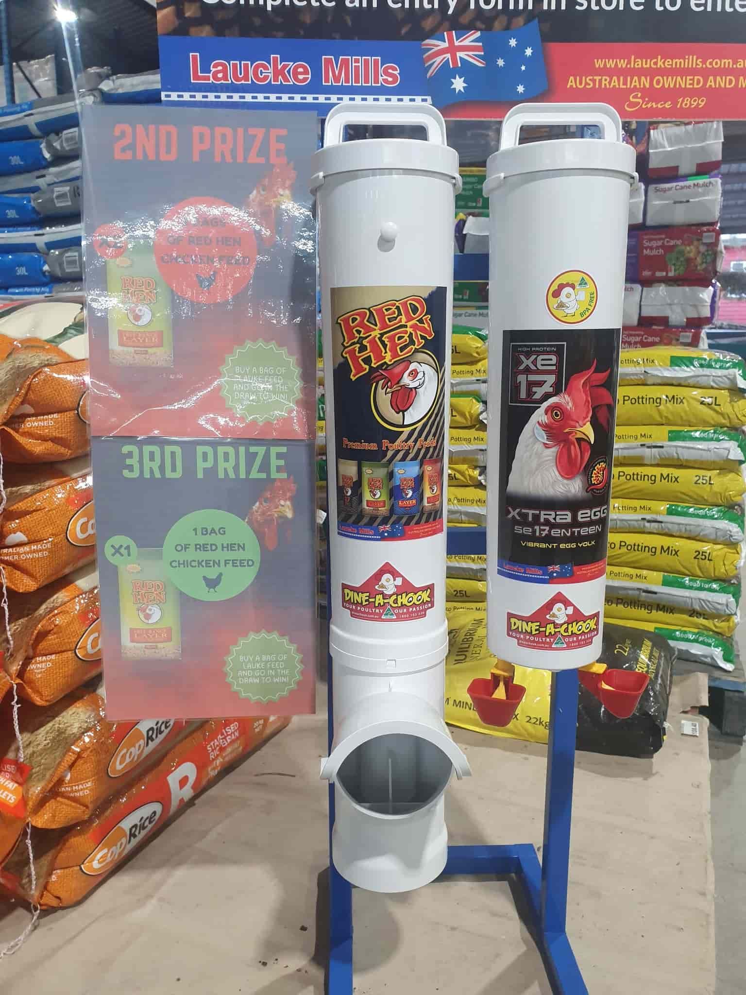 A Chicken Feeder Is Sitting On A Stand In A Store — Maleny Hardware & Rural Supplies In Maleny, QLD