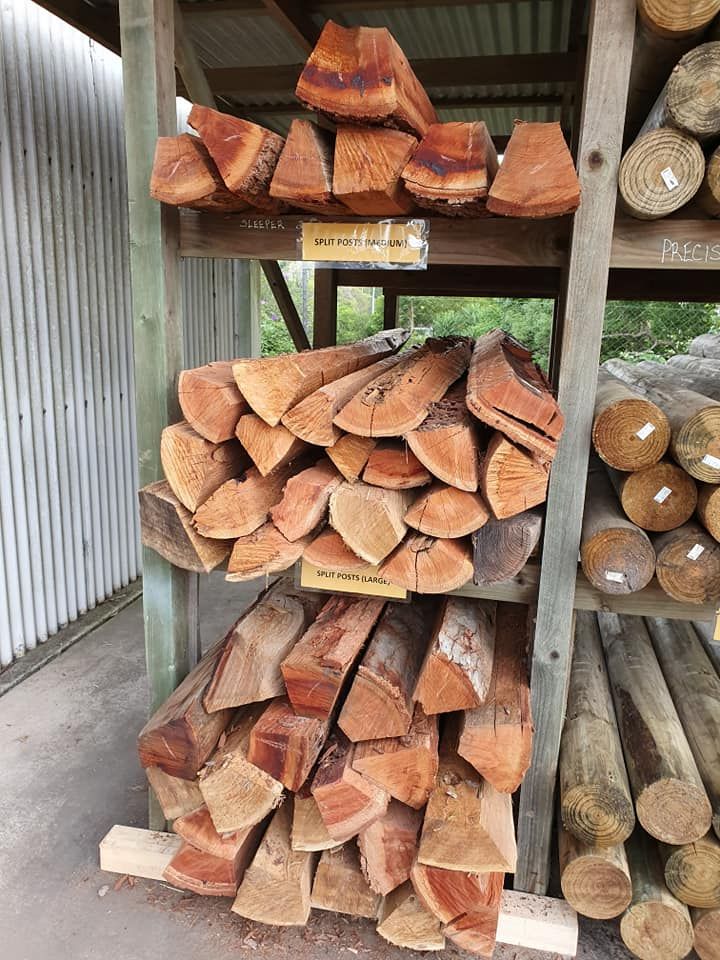 A Pile Of Wood Is Sitting On Top Of A Wooden Shelf — Maleny Hardware & Rural Supplies In Maleny, QLD