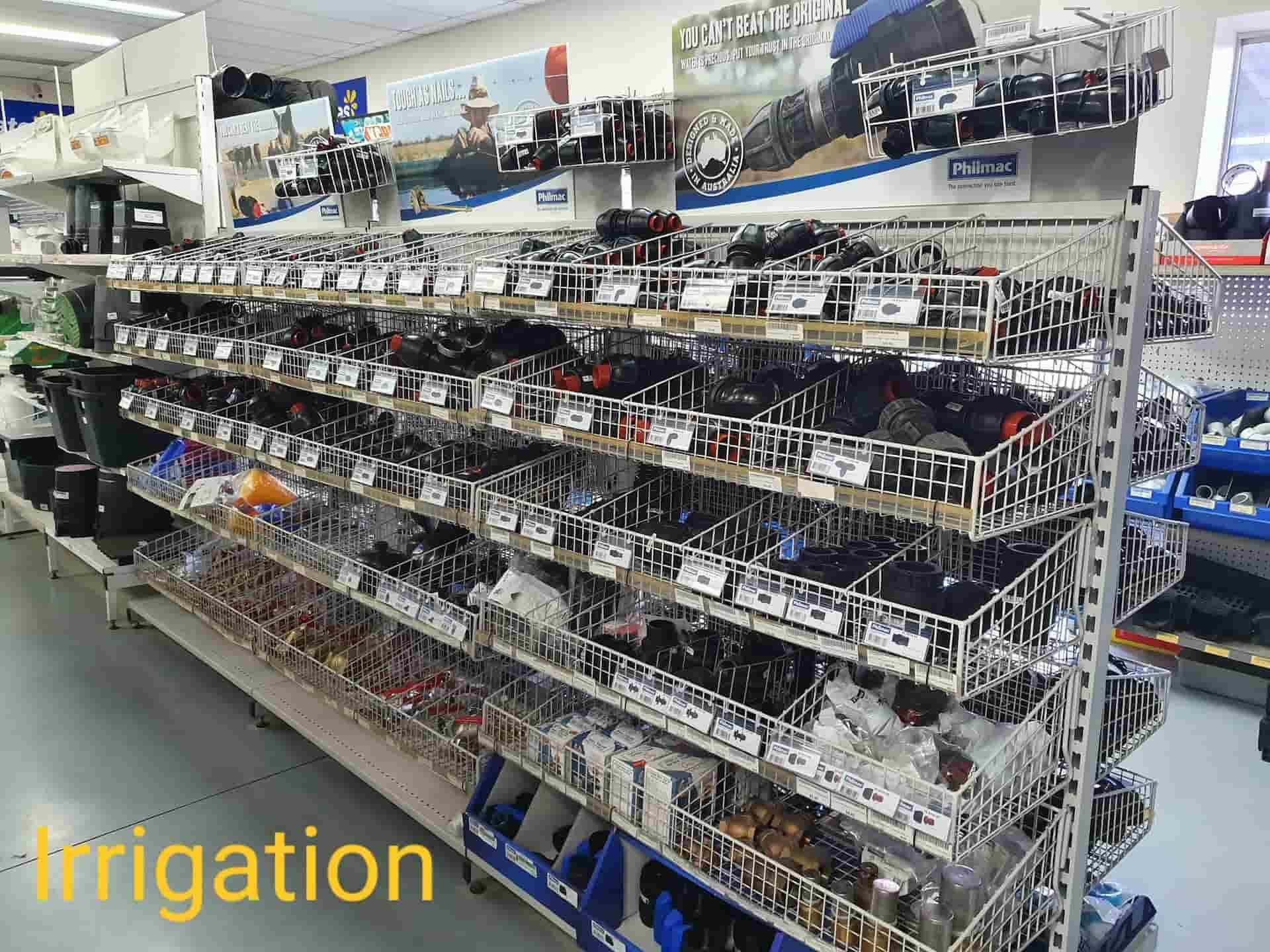 A Store Aisle With A Sign That Says Irrigation — Maleny Hardware & Rural Supplies In Maleny, QLD