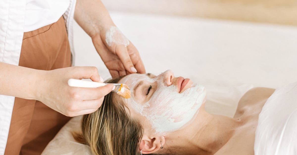 A woman is getting a facial treatment at a spa.