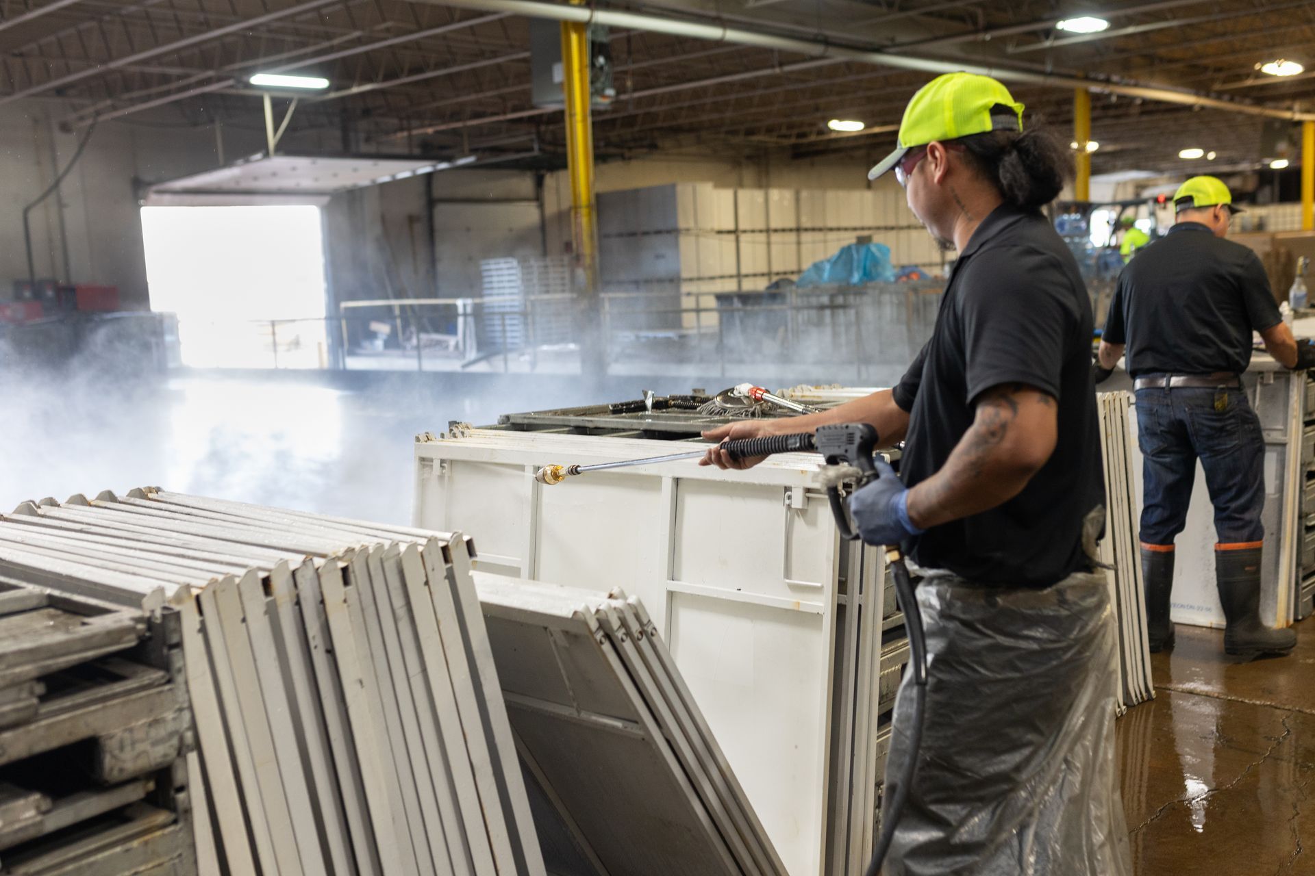 A group of men are working in a factory.