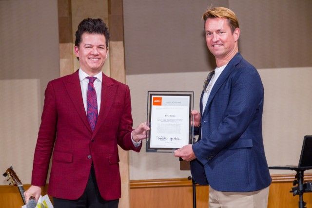 Bryce Conlan - ACCJ Chubu Leader of the Year - receiving her award on stage