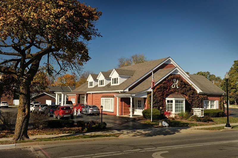 Exterior and interior photos of Hultgren Funeral Home and Cremation Center Wheaton Location
