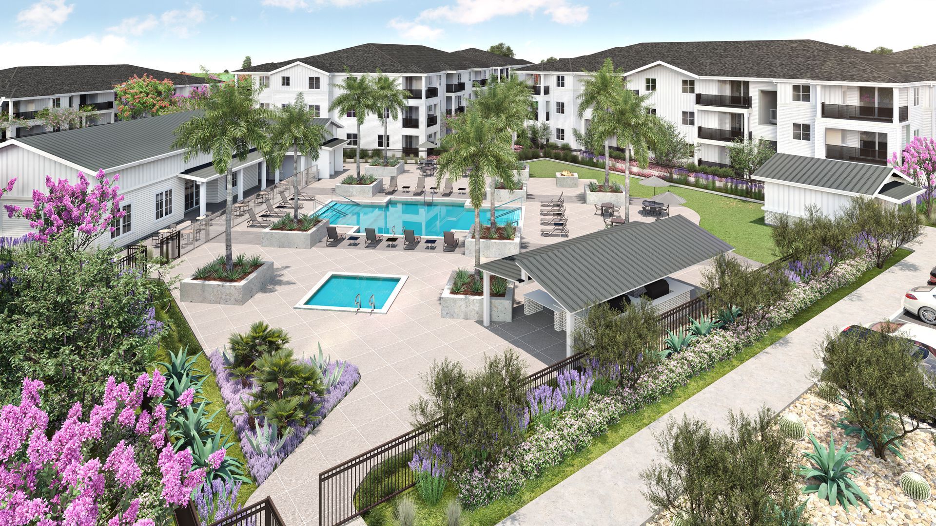 Aerial view of an apartment complex with a pool, cabana, and buildings. White and brown color scheme, palm trees.