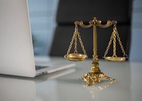 Picture of scales next to a laptop