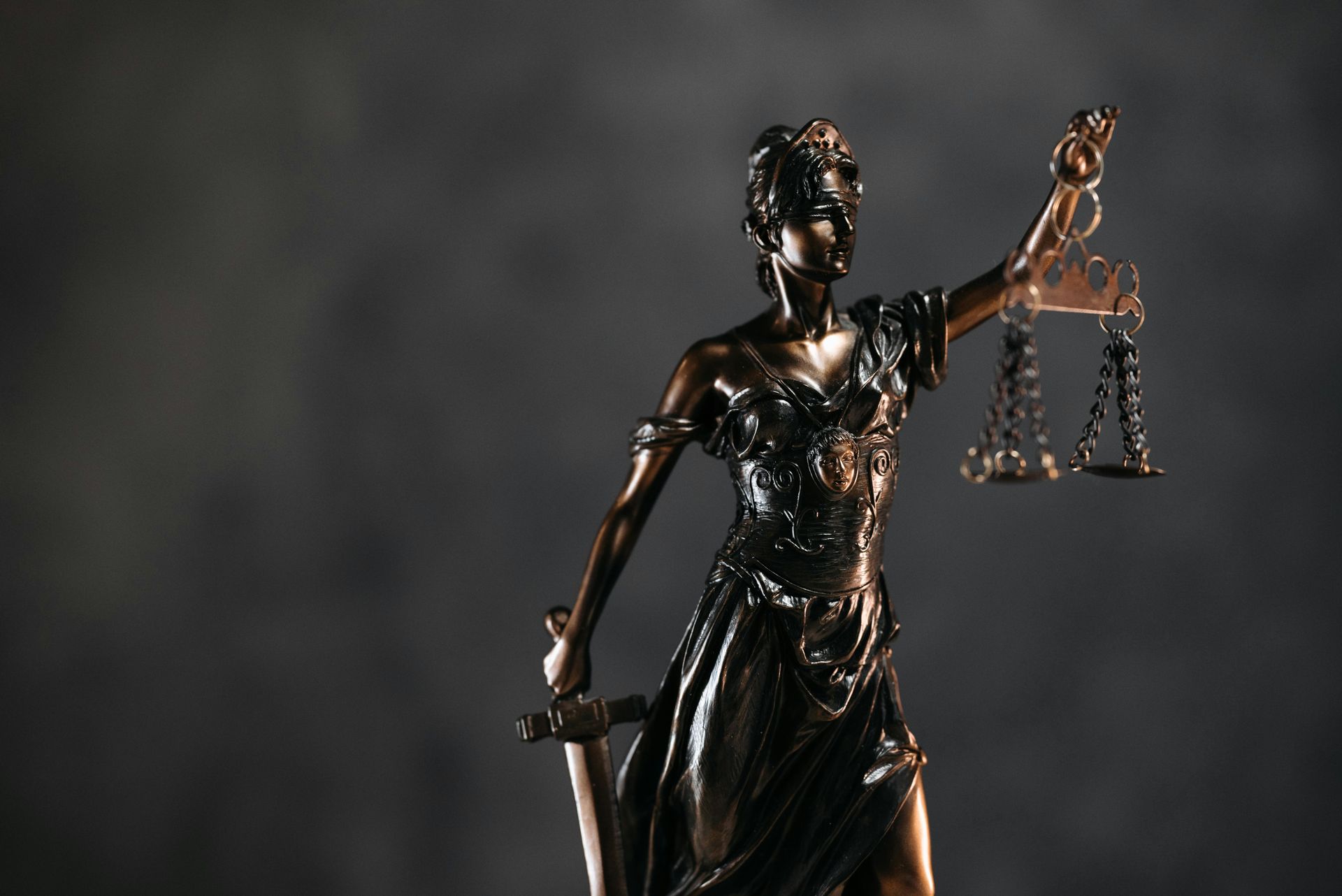 Statue holding scales and a sword