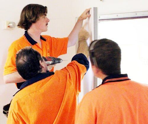 Three Men Building A Door - Door Specialist in Wauchope, NSW
