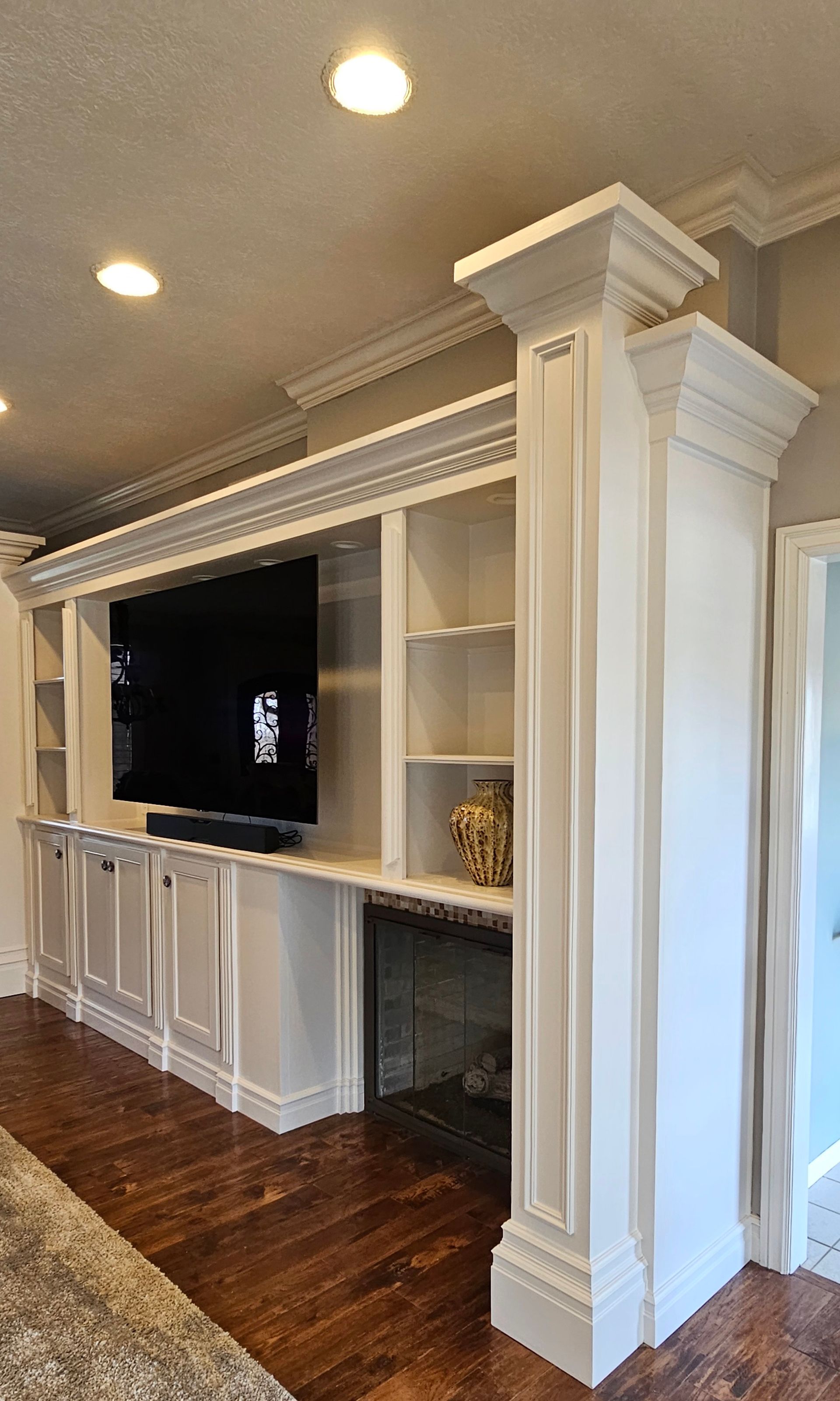 There is a fireplace in the middle of the room.