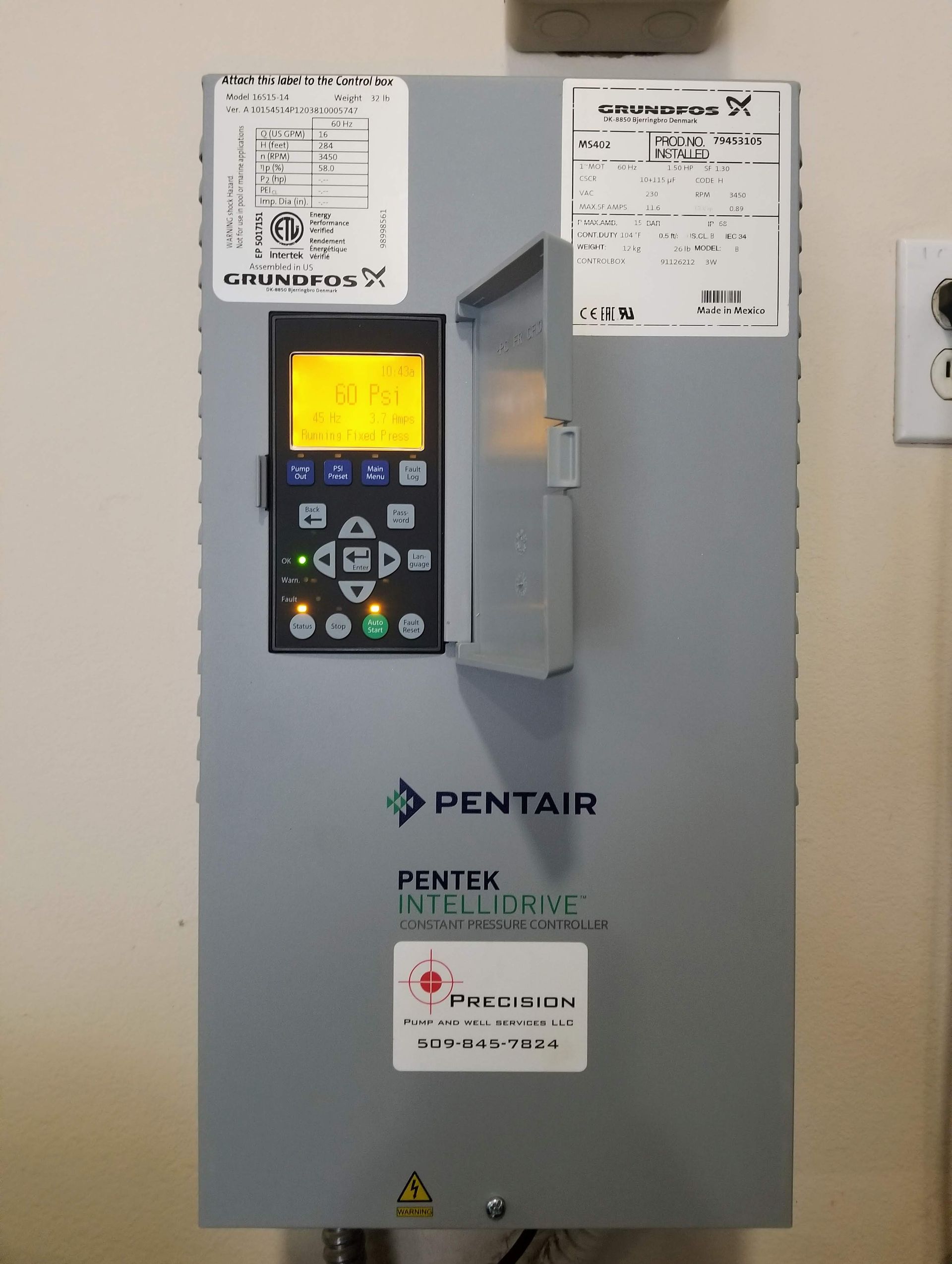 A pentair control box is hanging on a wall