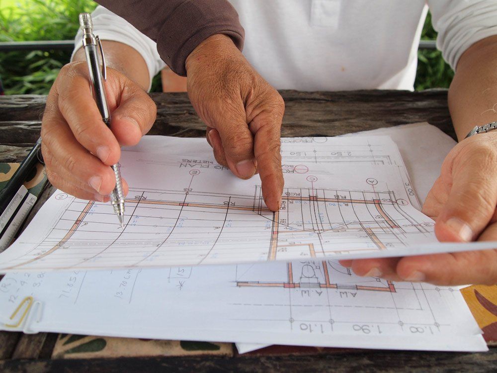 Client Ponting His Hand on the Structural Planner — Structural Engineer in Berrimah NT
