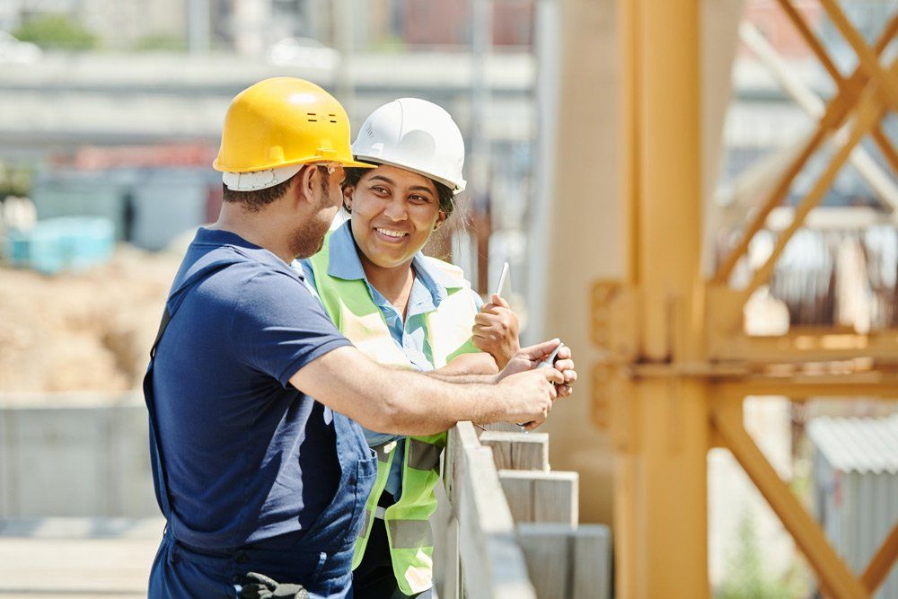 Two Engineers Talking on a Construction Site — Structural Engineer in Berrimah NT