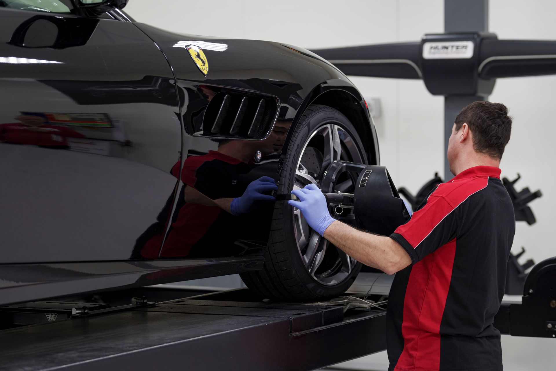 Staff repairing a FErrari
