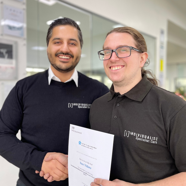 Reece being presented his certificate by Ajay Pooni