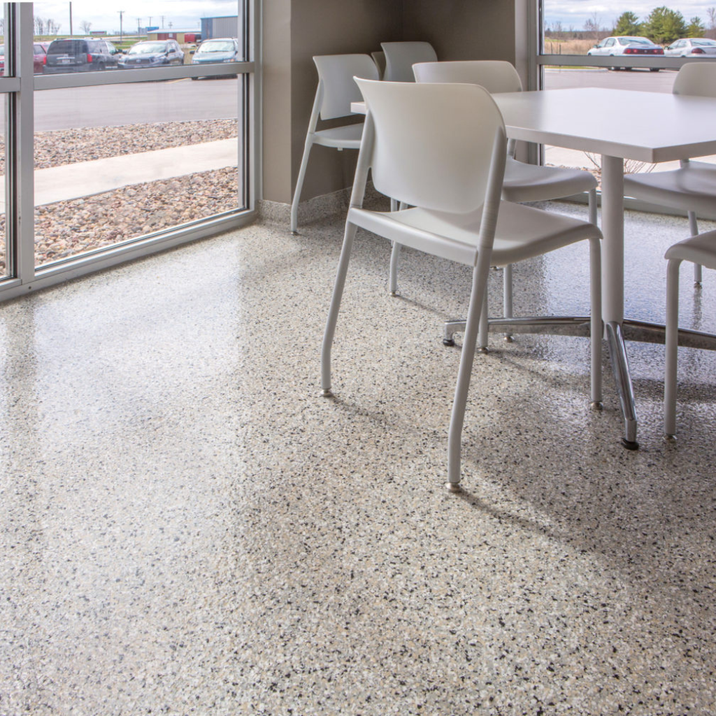 A view of a commercial space with cabin fever concrete coating flakes 