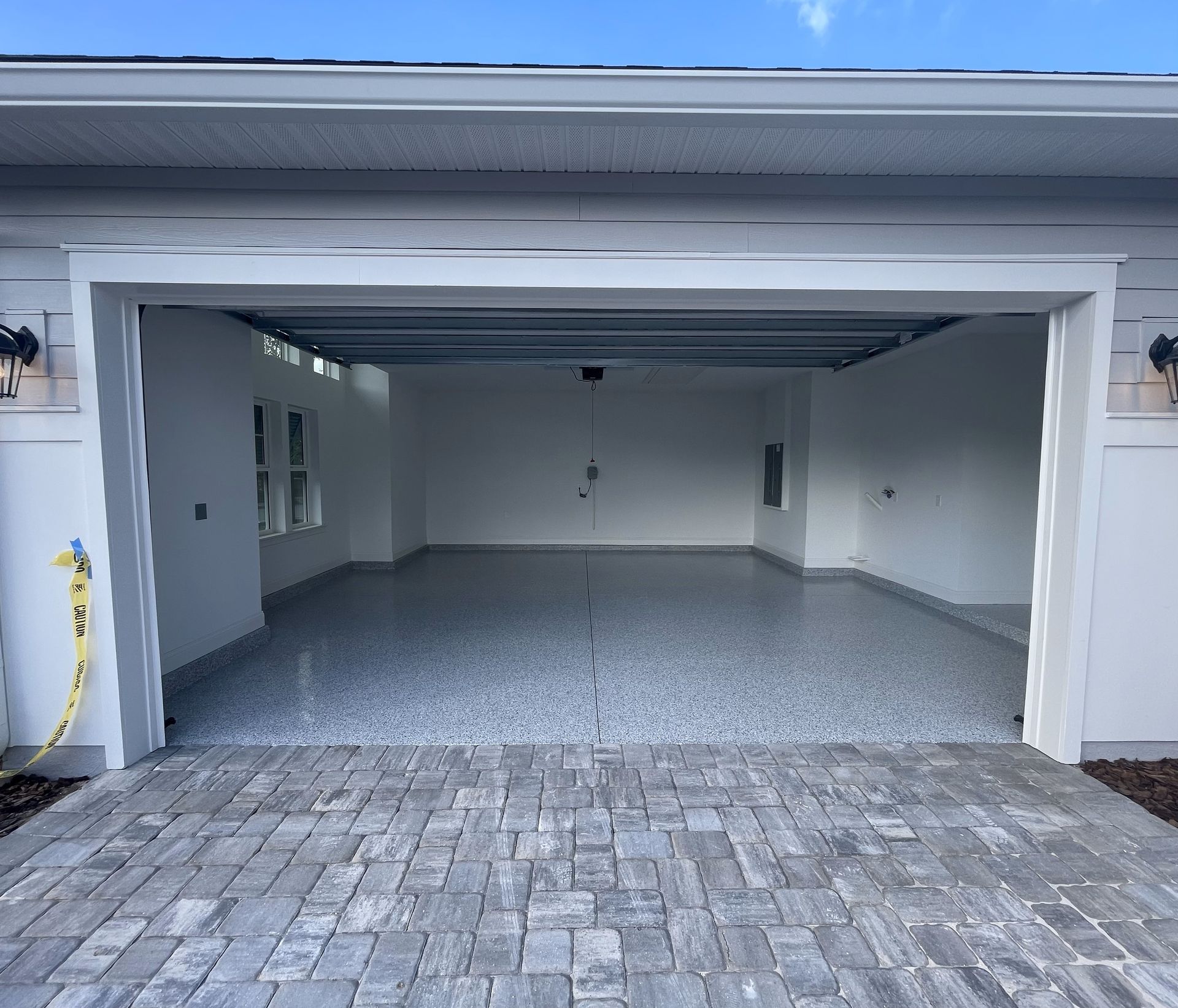Blue color epoxy garage floors recently installed for a new build in Jacksonville, FL.
