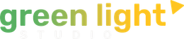 A green light studio logo with a yellow arrow pointing to the right