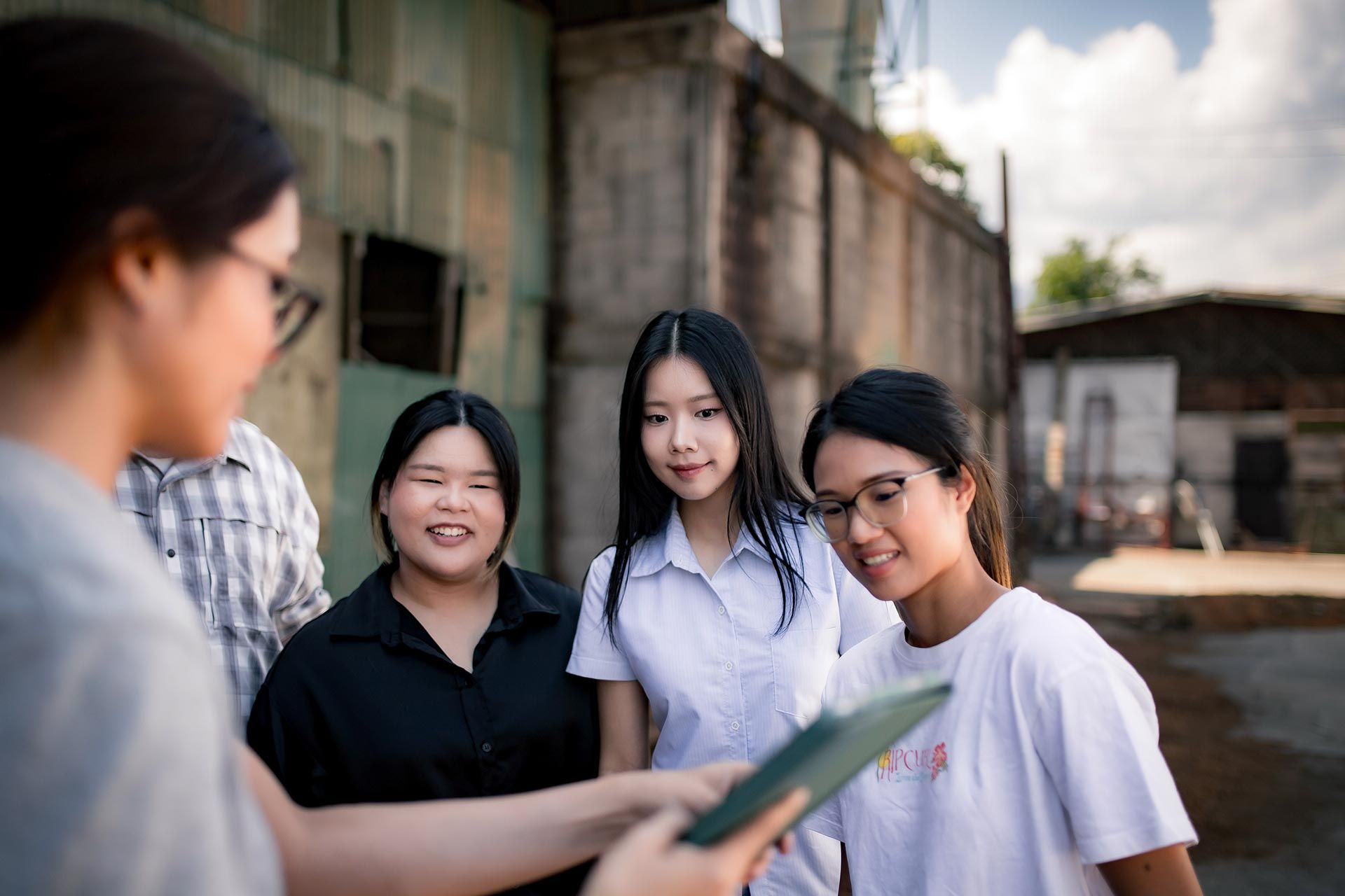 The Green Light Studio team visiting a local Chiang Mai bespoke wood furniture producer